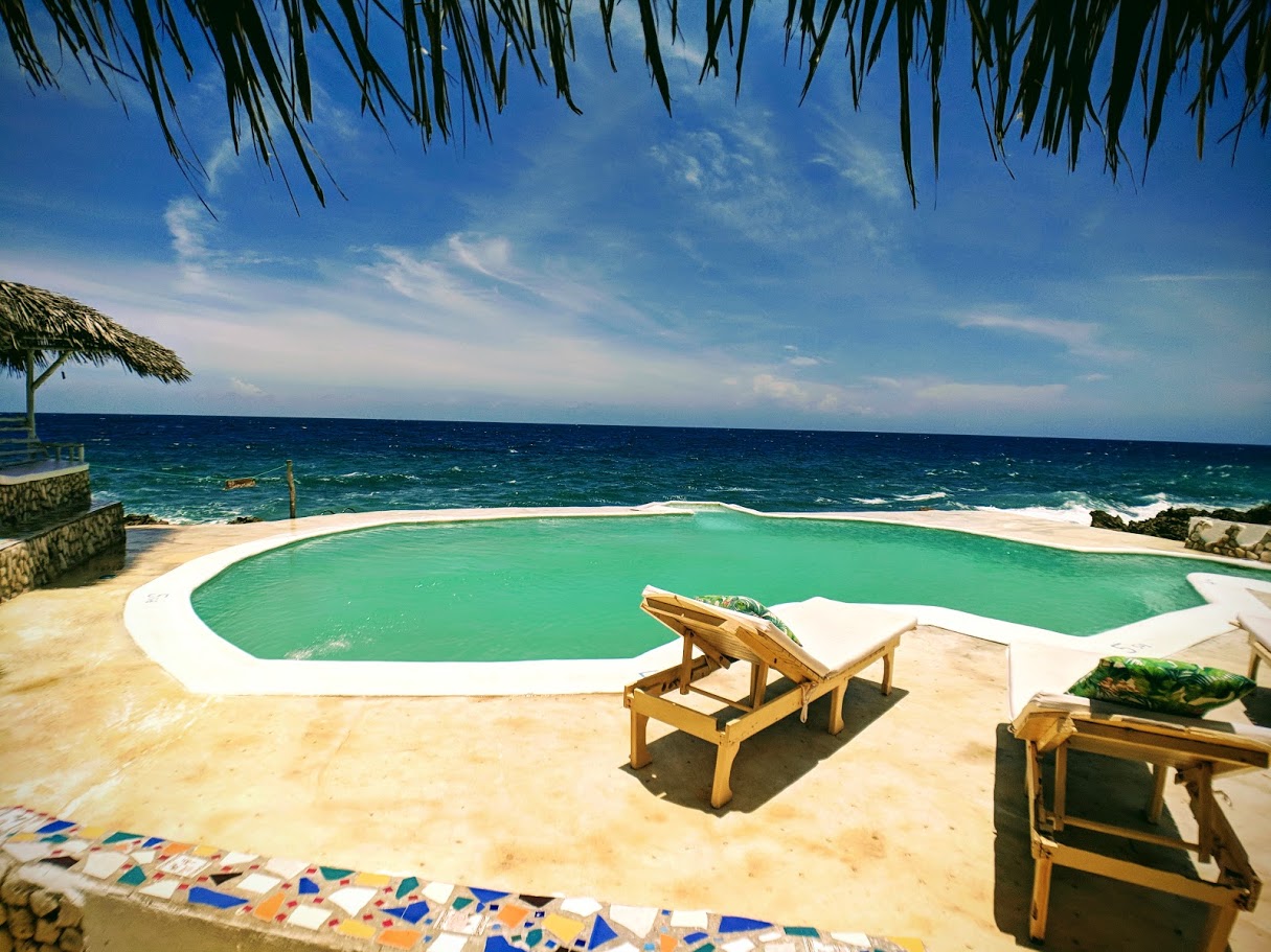 View of pool and ocean at Somewhere West